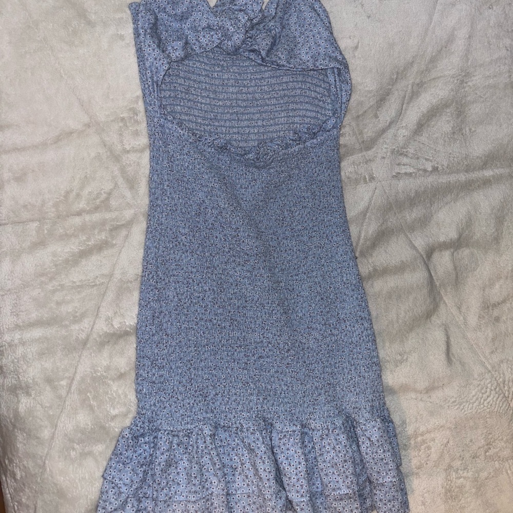 blue floral dress. open front. closed back